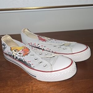 Converse White Low-Top Kids Slip-On Sneakers with Red Trim and Colorful Graphic